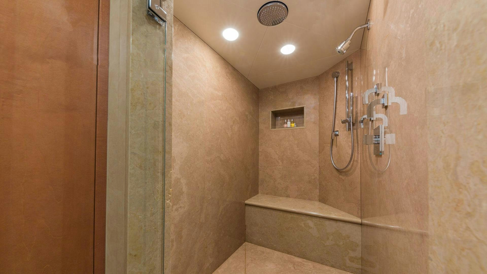 a bathroom with a shower unit aboard AT LAST Yacht for Sale