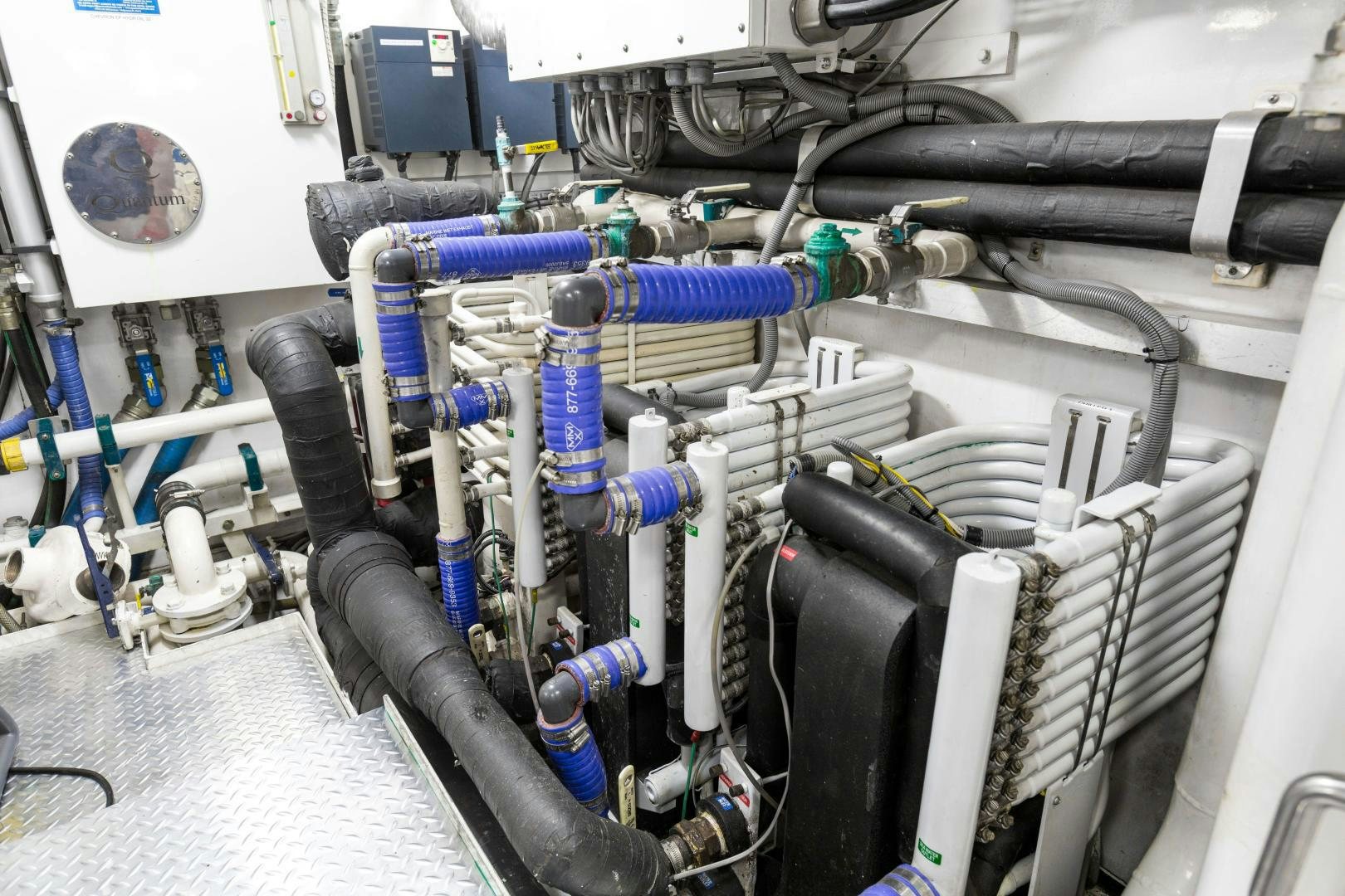 a machine with blue pipes aboard AT LAST Yacht for Sale
