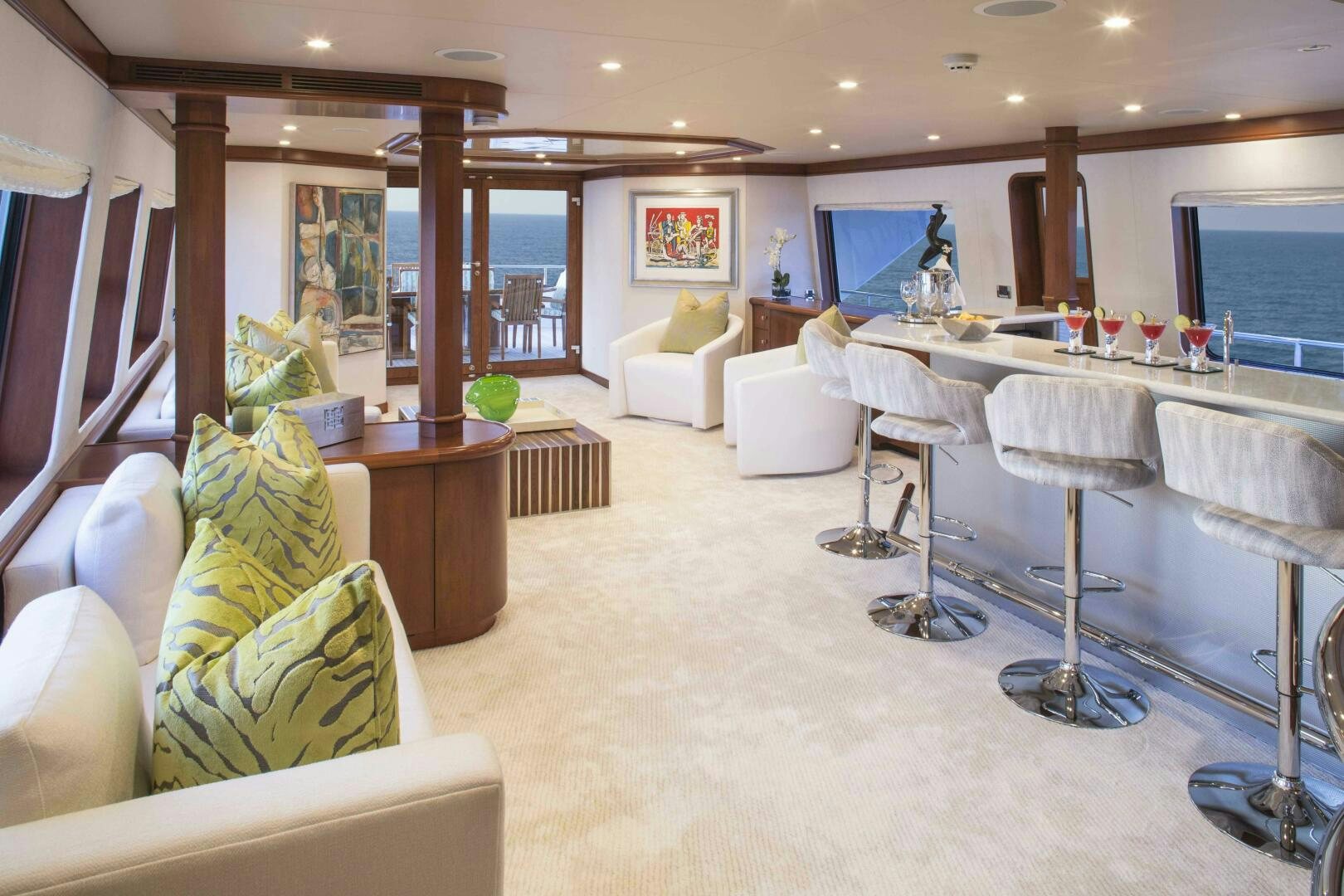 a room with a table chairs and a tv aboard AT LAST Yacht for Sale