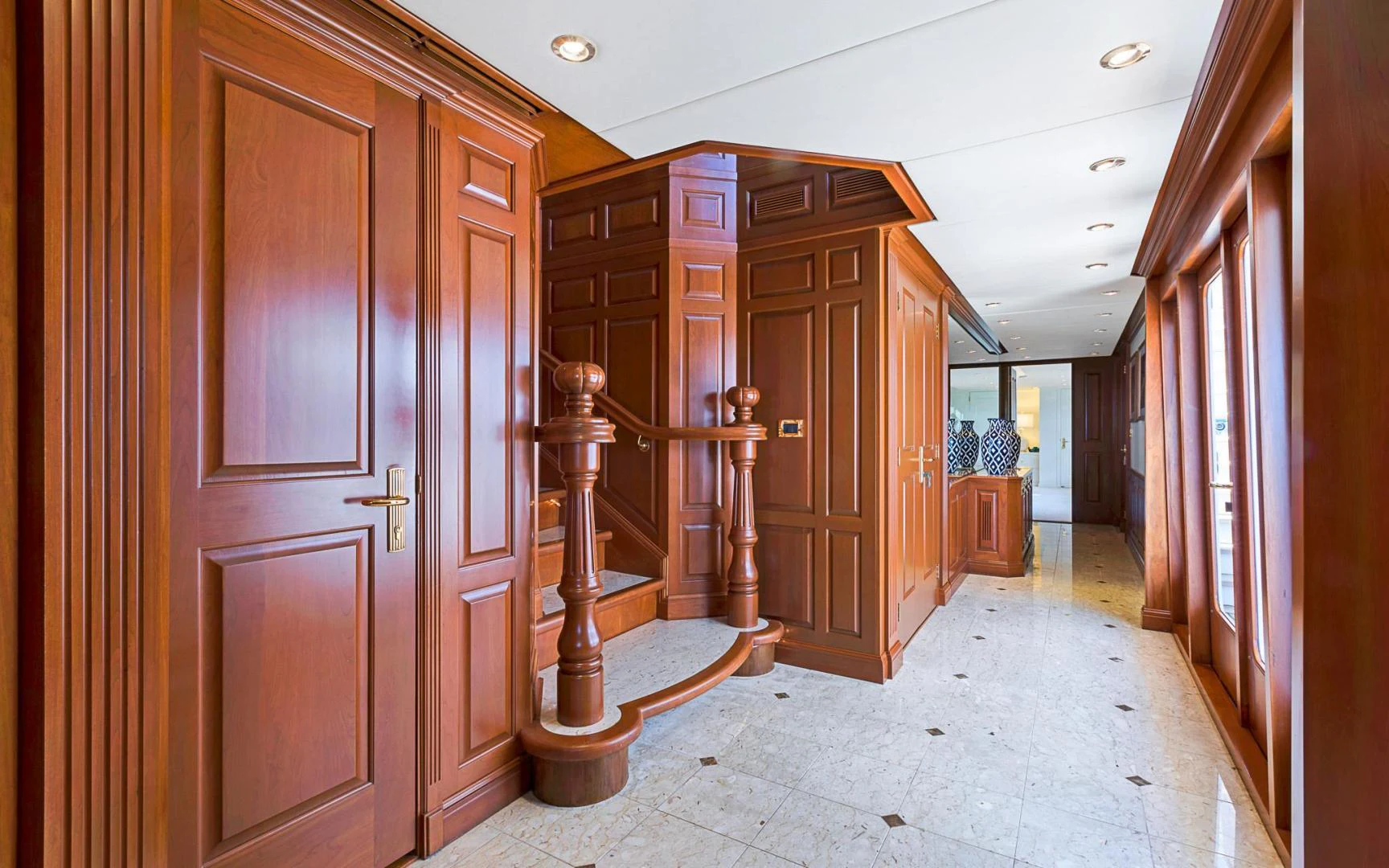 a hallway with wood doors aboard TRUE NORTH Yacht for Sale
