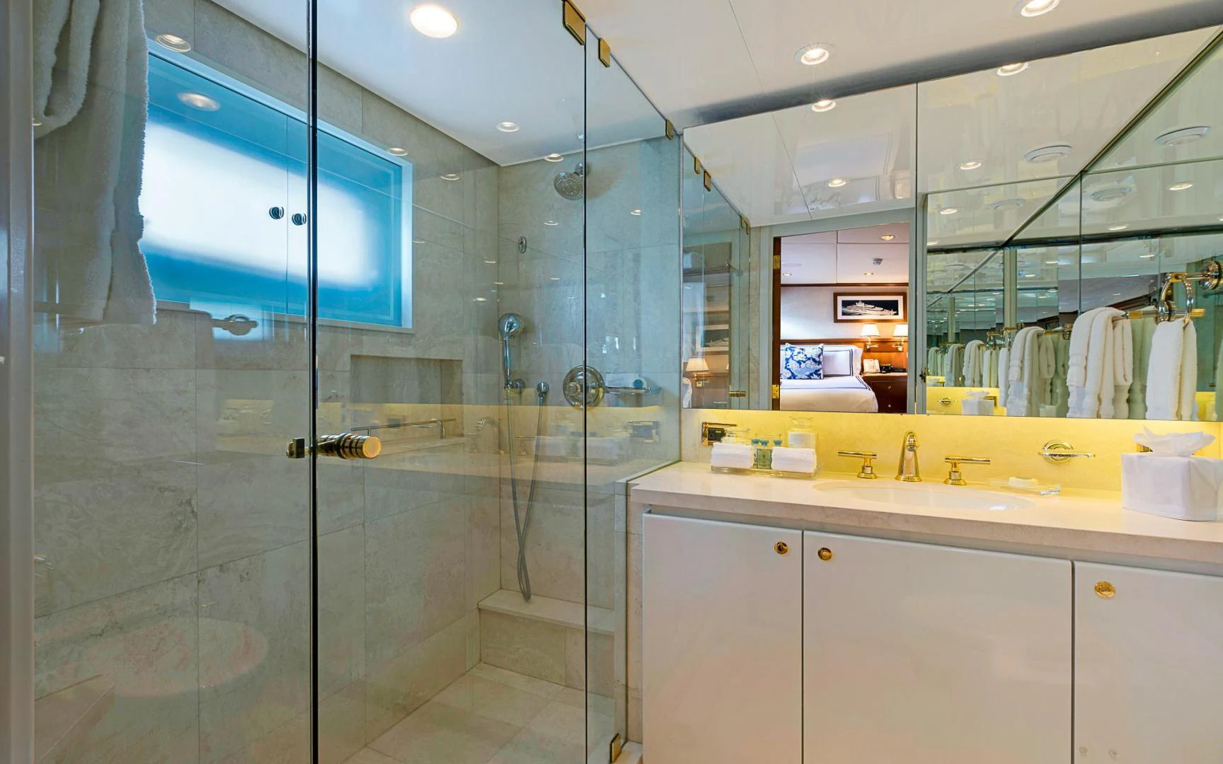 a bathroom with a glass shower aboard TRUE NORTH Yacht for Sale
