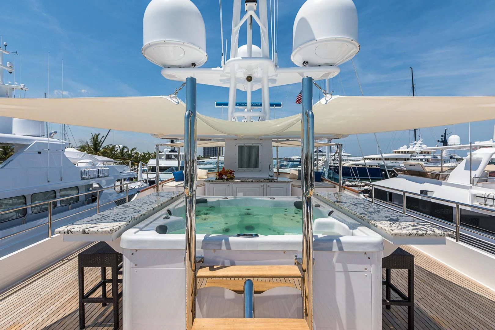 a deck with a pool and a building with a white dome and a white dome on top of aboard TRUE NORTH Yacht for Sale