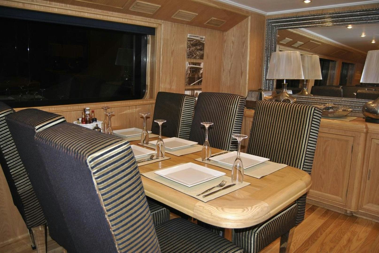 a large room with a table and chairs aboard NO NAME Yacht for Sale