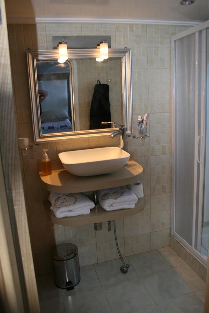 a bathroom with a large mirror aboard NO NAME Yacht for Sale