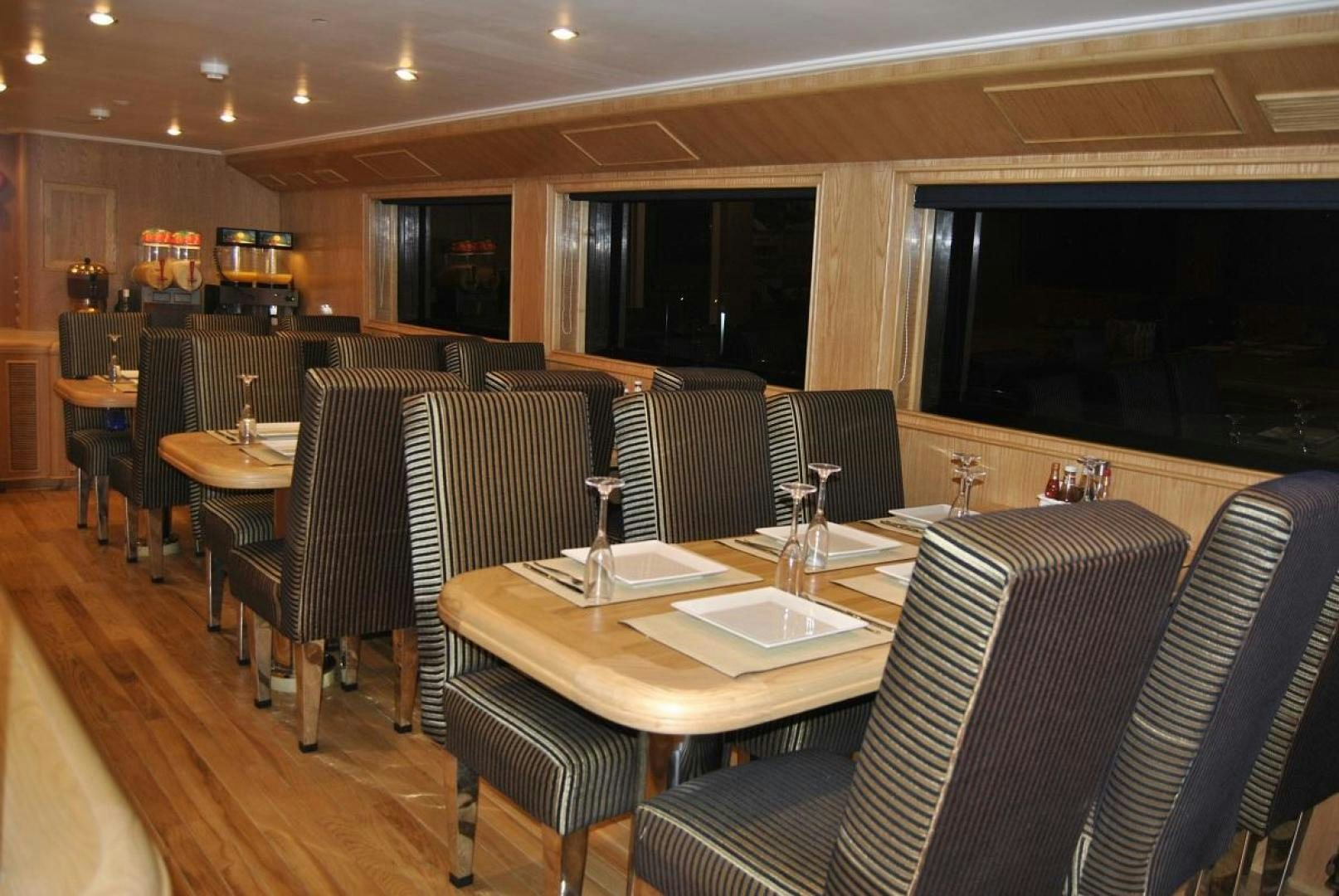 a restaurant with a table and chairs aboard NO NAME Yacht for Sale