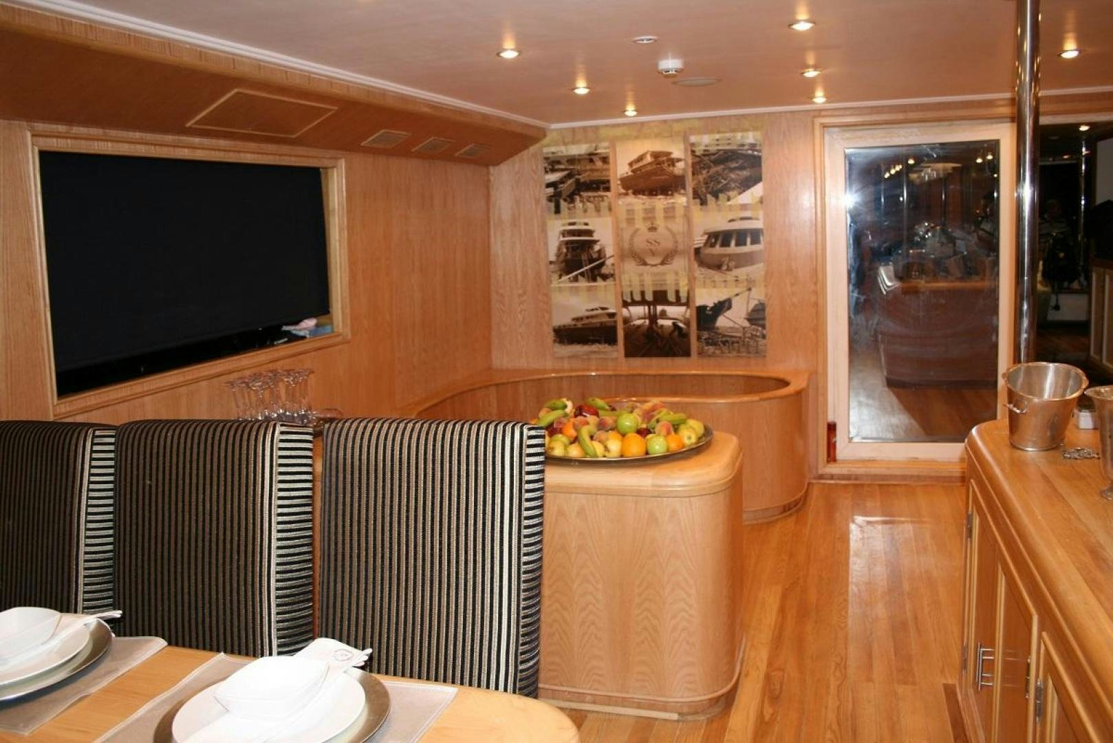 a room with a table and chairs aboard NO NAME Yacht for Sale