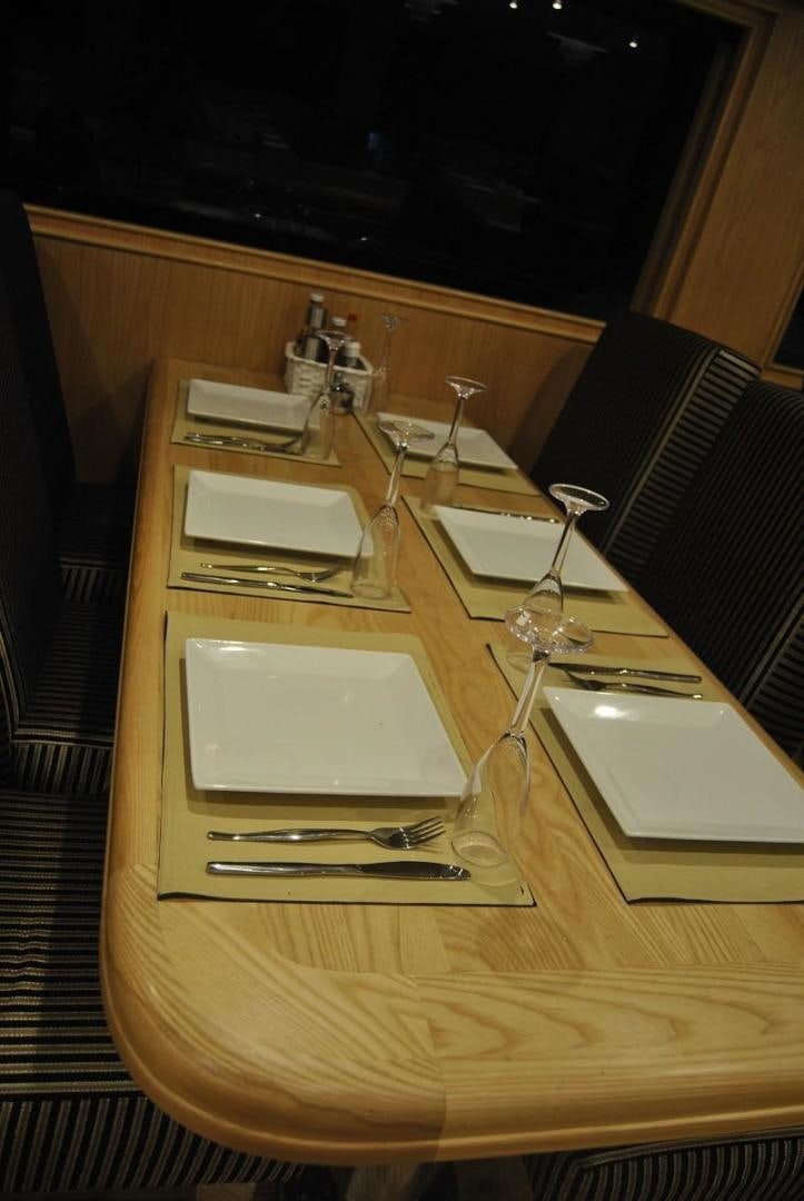 a table with a plate and glasses aboard NO NAME Yacht for Sale