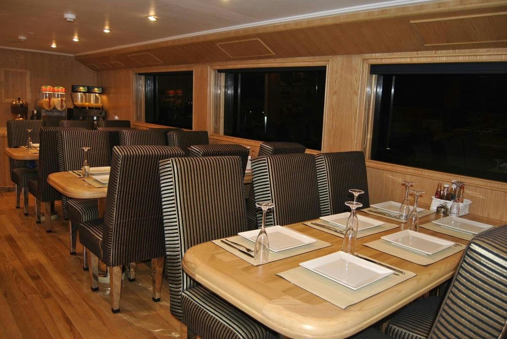 a restaurant with a table and chairs aboard NO NAME Yacht for Sale