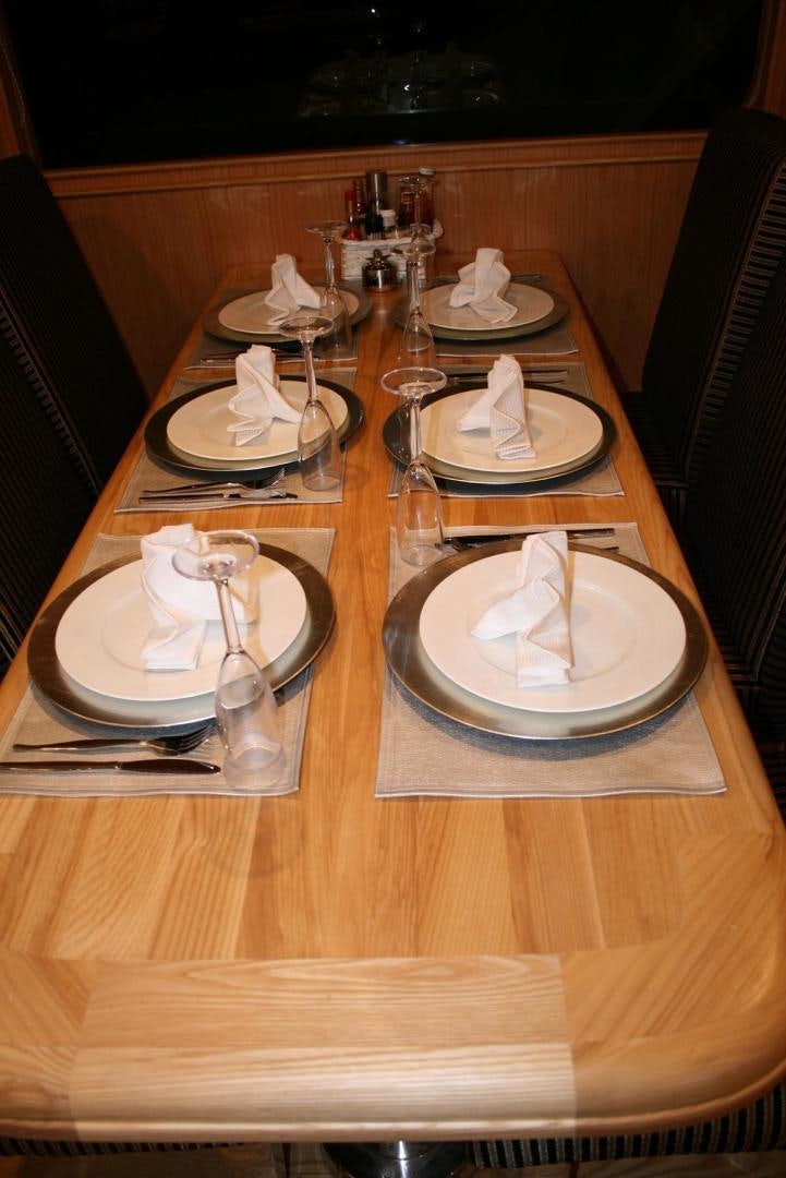 a table with plates and glasses aboard NO NAME Yacht for Sale