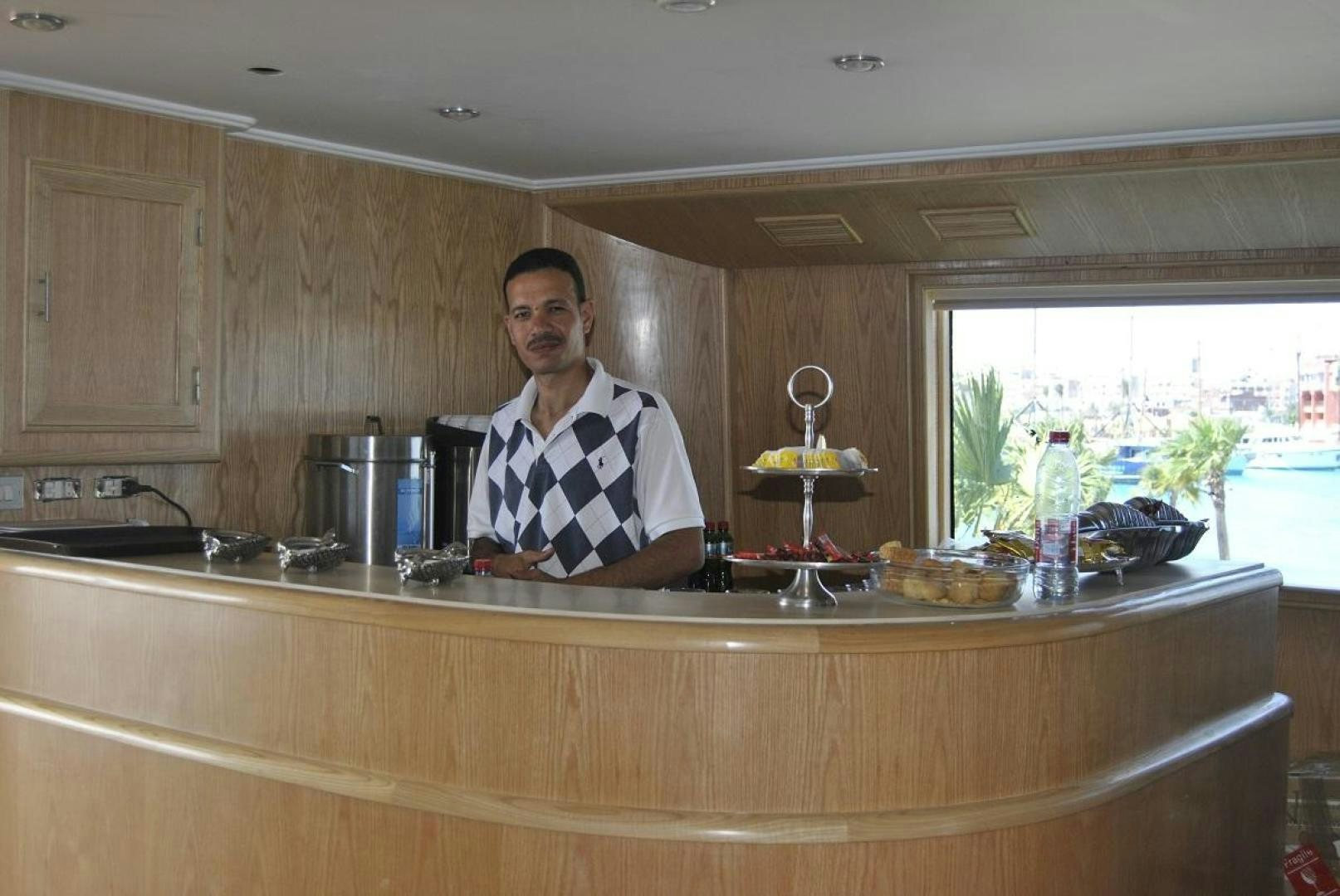 a person standing in a kitchen aboard NO NAME Yacht for Sale