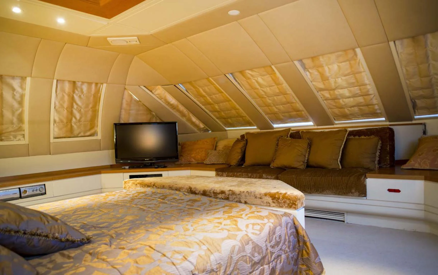 a bed and a couch in a room aboard GELLY Yacht for Sale
