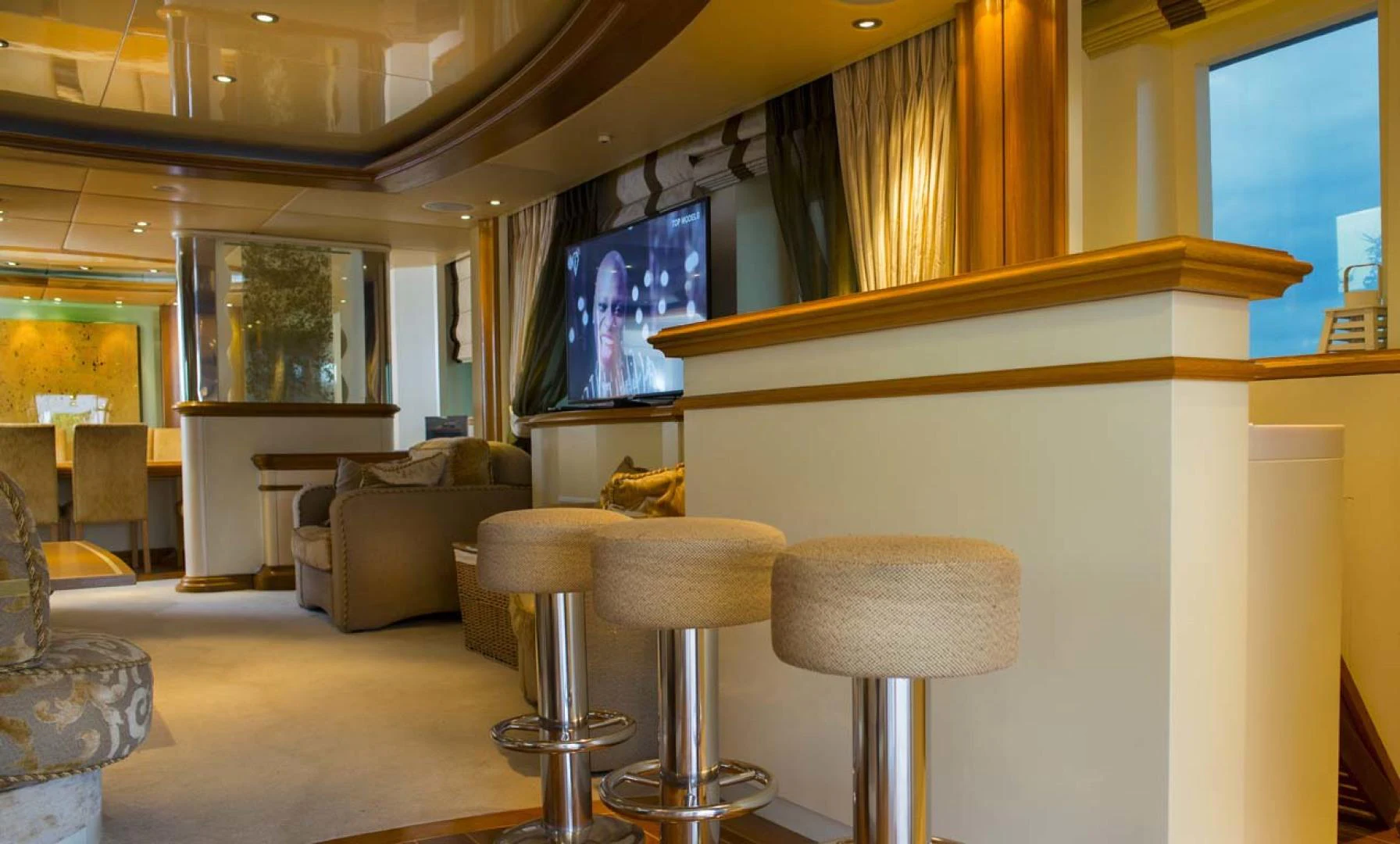 a room with a couch and a television aboard GELLY Yacht for Sale
