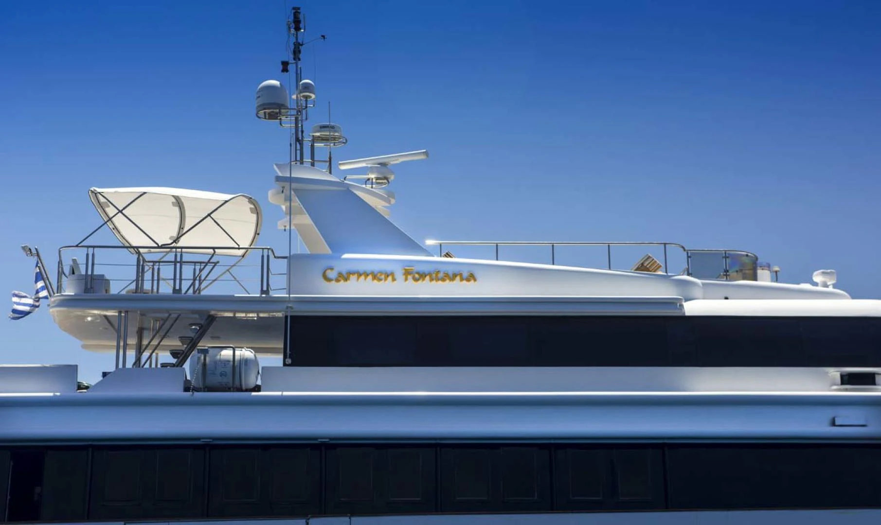 a large white boat with a satellite dish on top aboard GELLY Yacht for Sale