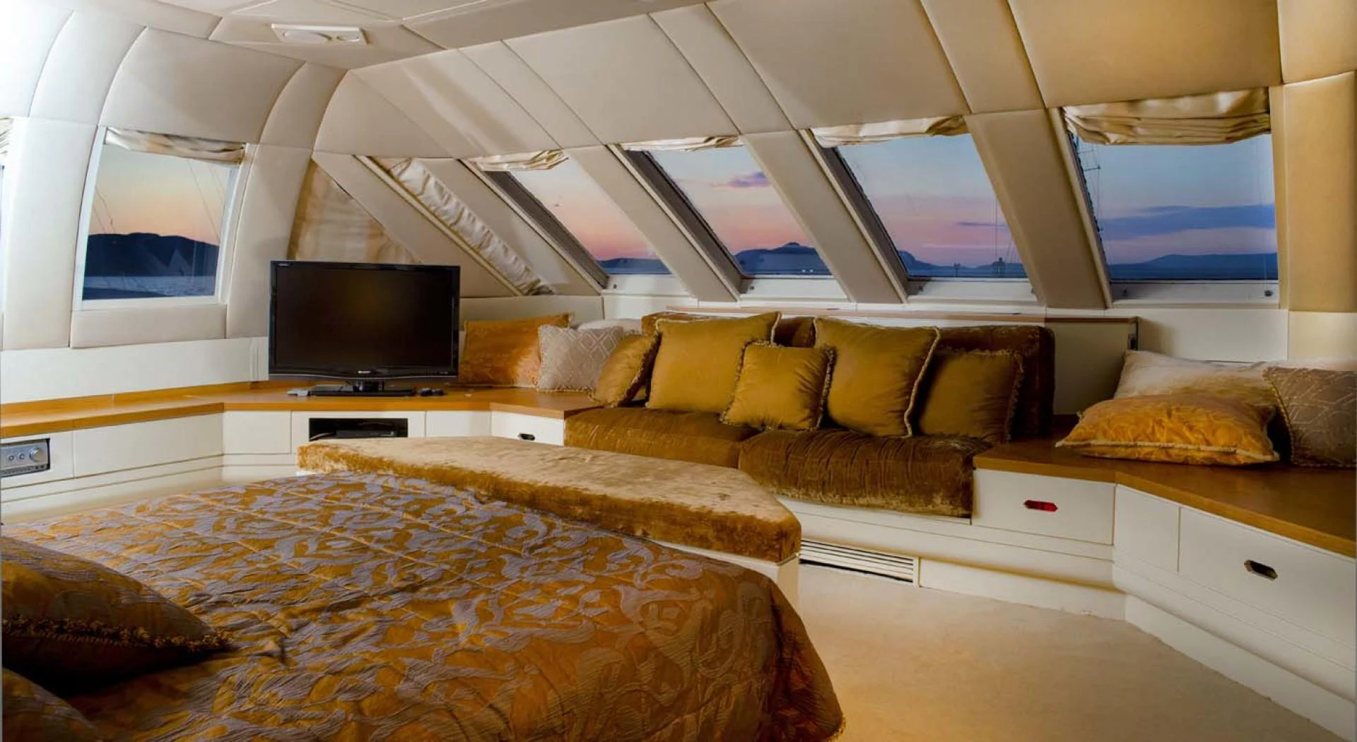 a bedroom with a bed and a tv aboard GELLY Yacht for Sale