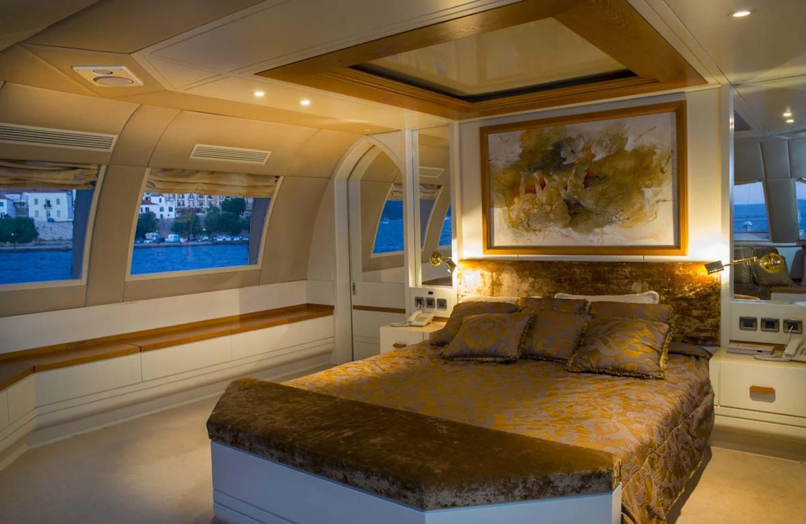 a large room with a couch and a painting on the wall aboard GELLY Yacht for Sale