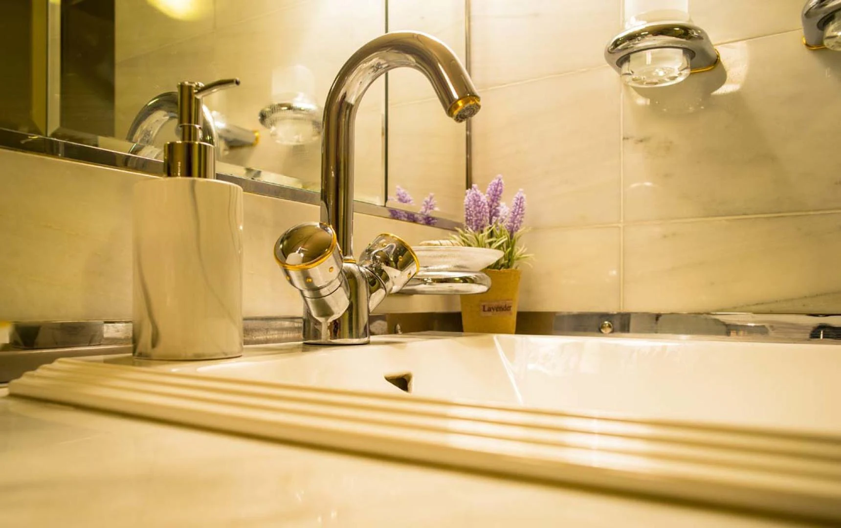 a bathroom sink with a mirror aboard GELLY Yacht for Sale