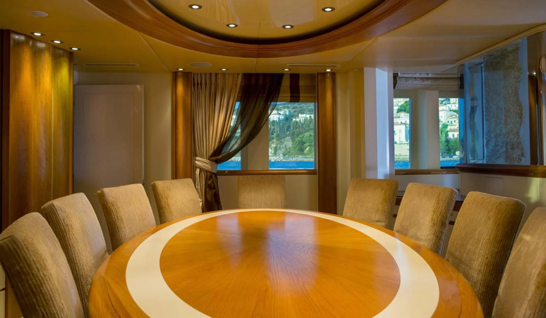 a room with a table and chairs aboard GELLY Yacht for Sale