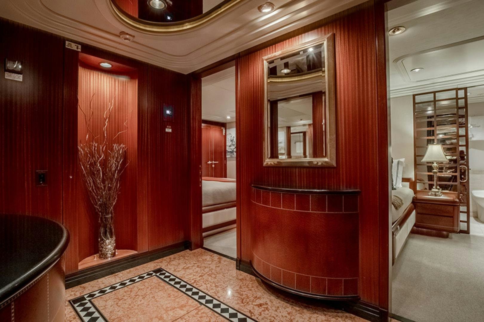 a bathroom with a red shower curtain aboard NEVER ENOUGH Yacht for Charter
