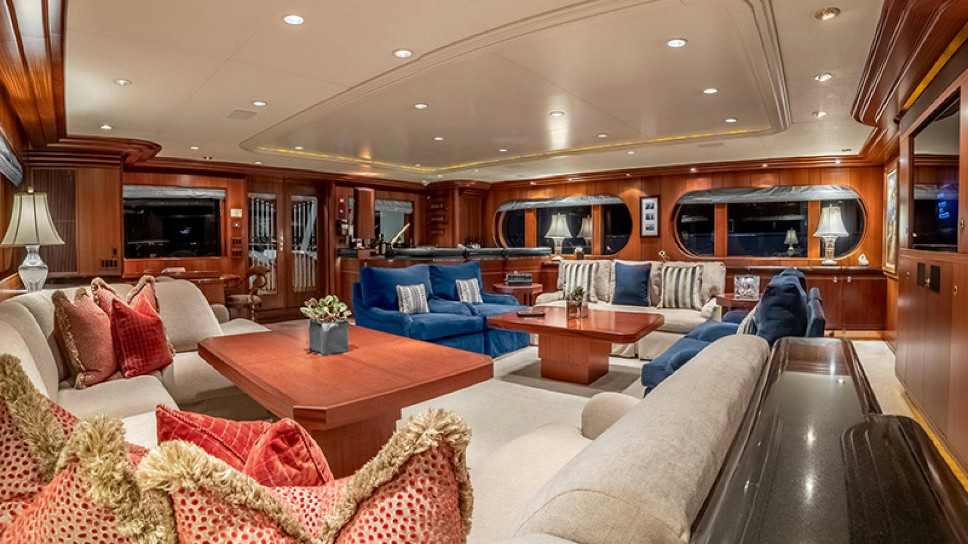 a living room with a couch and a table aboard NEVER ENOUGH Yacht for Charter
