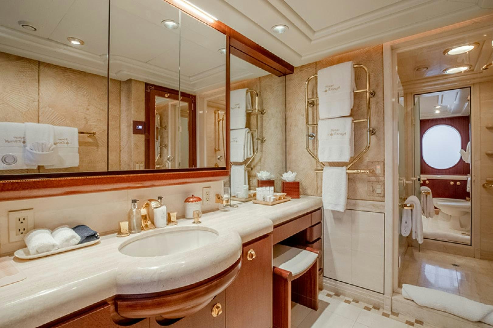 a bathroom with a large mirror aboard NEVER ENOUGH Yacht for Charter
