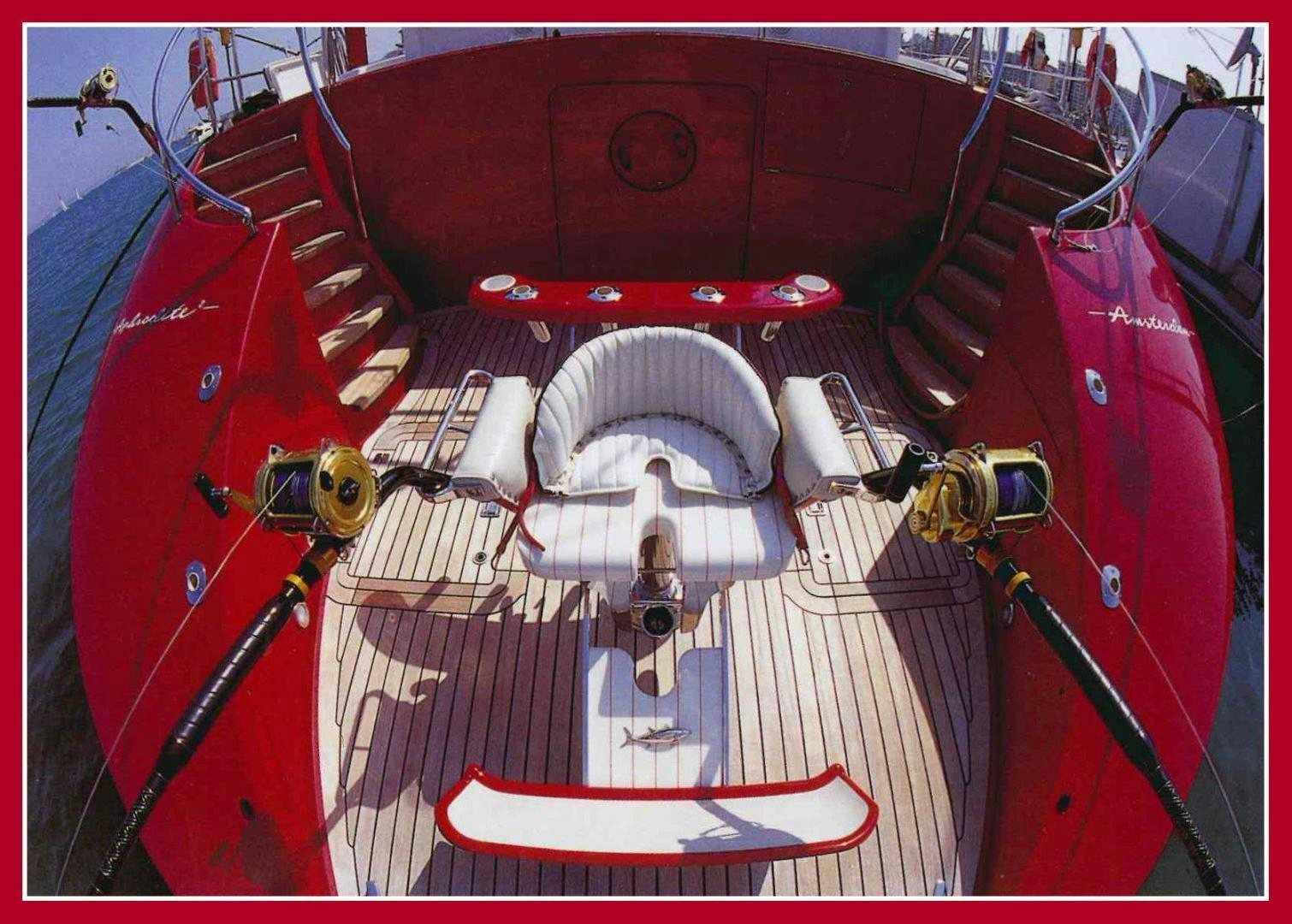 the inside of a red car aboard DELUSHA Yacht for Sale