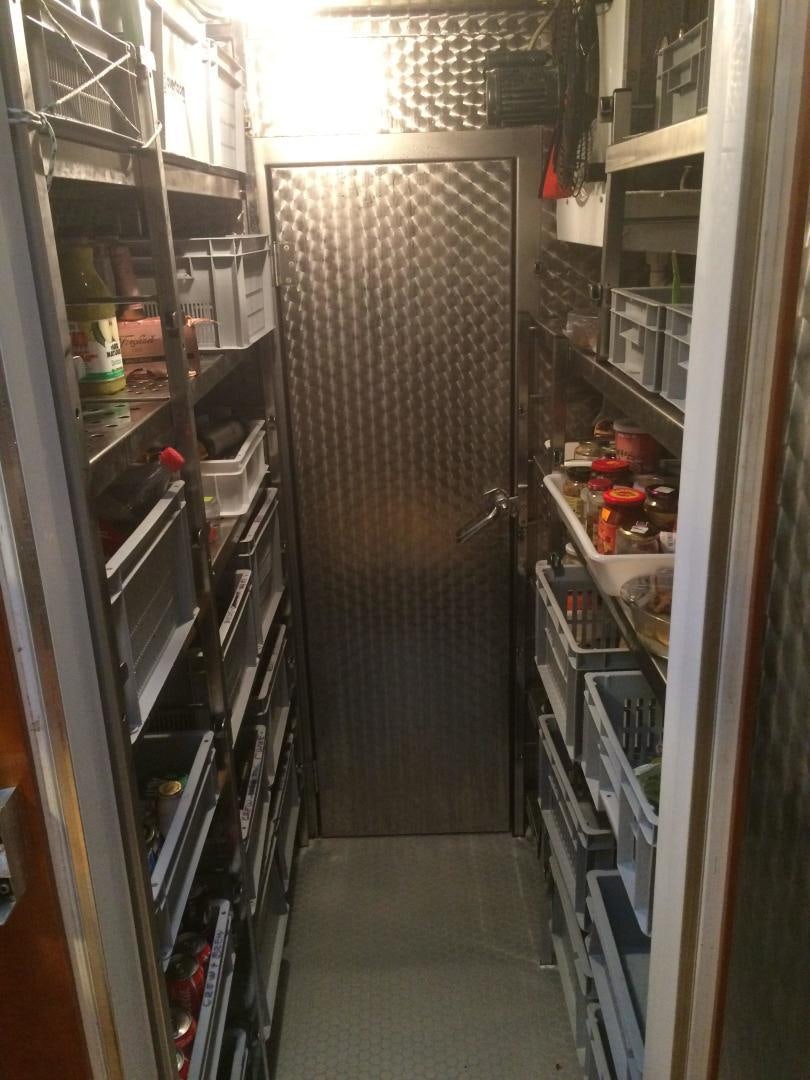 a room with shelves and shelves aboard DELUSHA Yacht for Sale