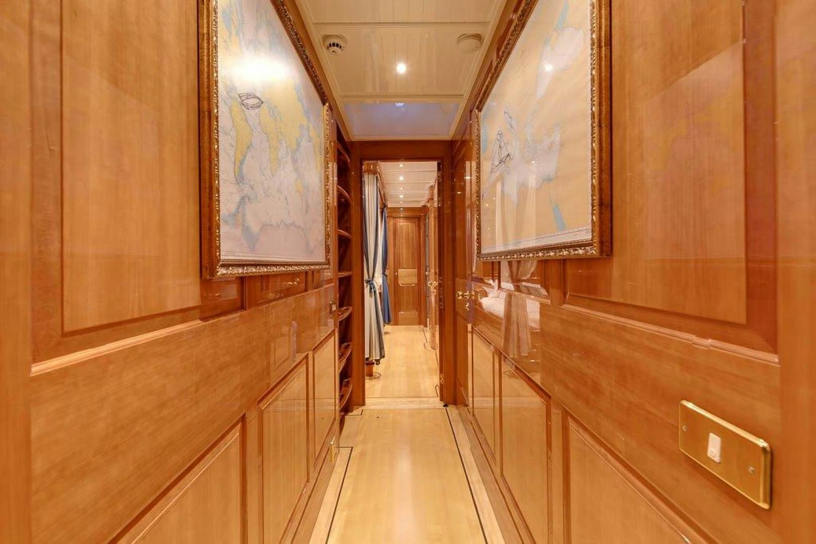 a hallway with wooden cabinets aboard DELUSHA Yacht for Sale
