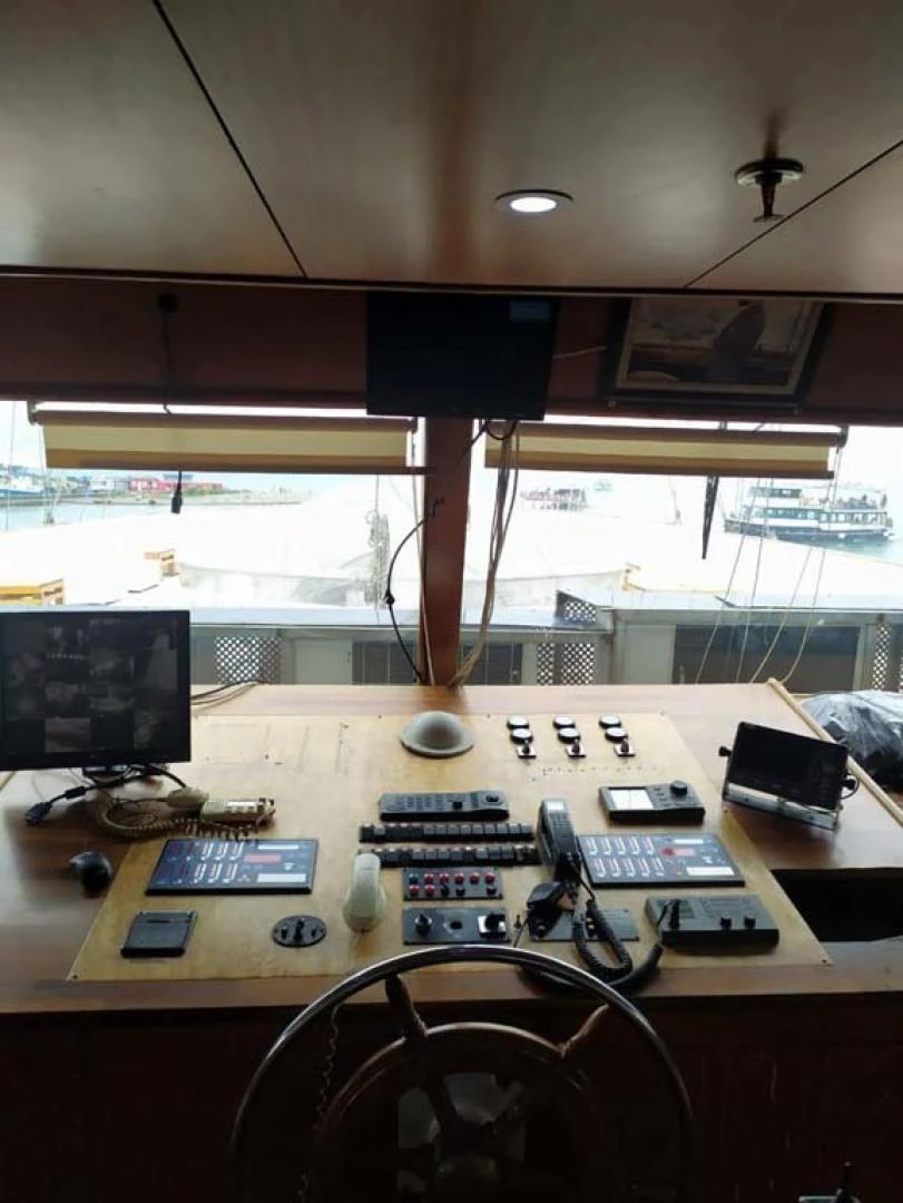 a desk with a computer and electronics aboard MY DREAM Yacht for Sale
