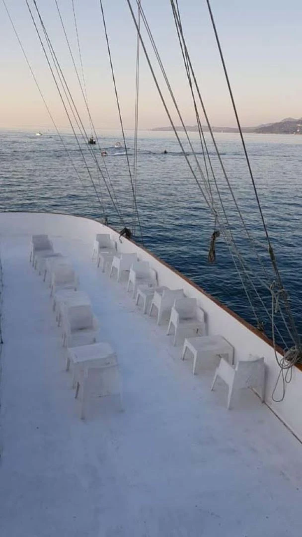 a deck with chairs on it and a body of water in the background aboard MY DREAM Yacht for Sale