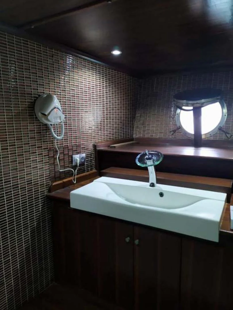 a bathroom with a sink and a mirror aboard MY DREAM Yacht for Sale