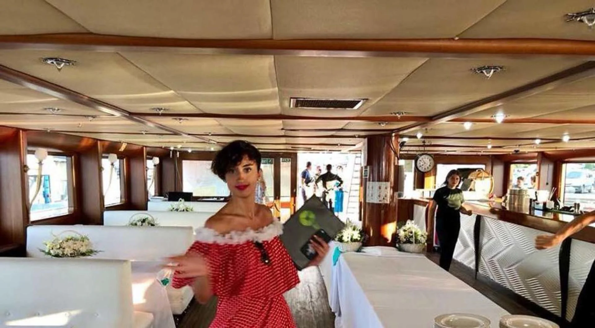 a woman in a red dress aboard MY DREAM Yacht for Sale