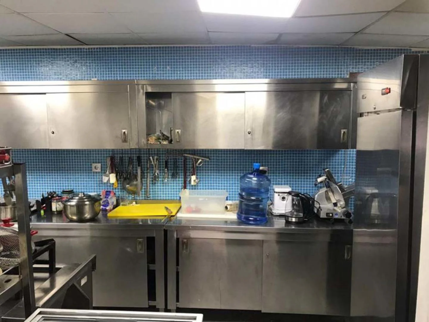 a kitchen with a lot of stainless steel appliances aboard MY DREAM Yacht for Sale