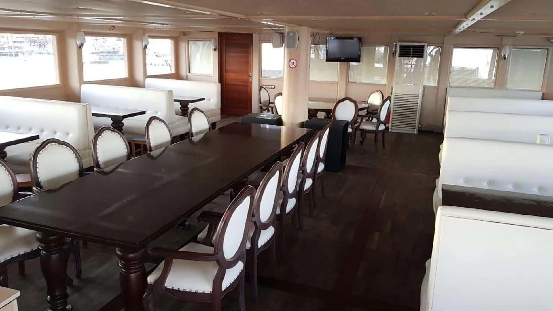 a room with a table and chairs aboard MY DREAM Yacht for Sale