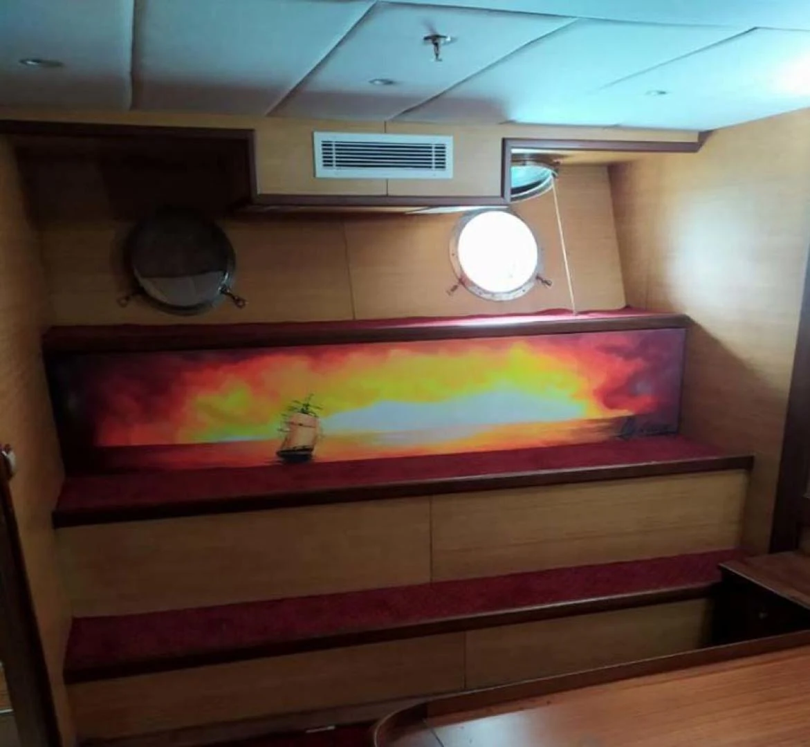a room with a large painting on the wall aboard MY DREAM Yacht for Sale