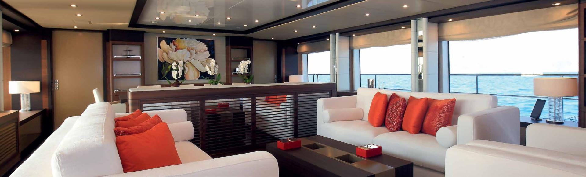 a room with a bed and a table aboard DREW Yacht for Sale