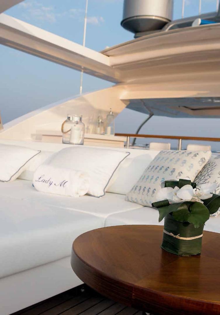 a bed with white sheets and pillows aboard DREW Yacht for Sale