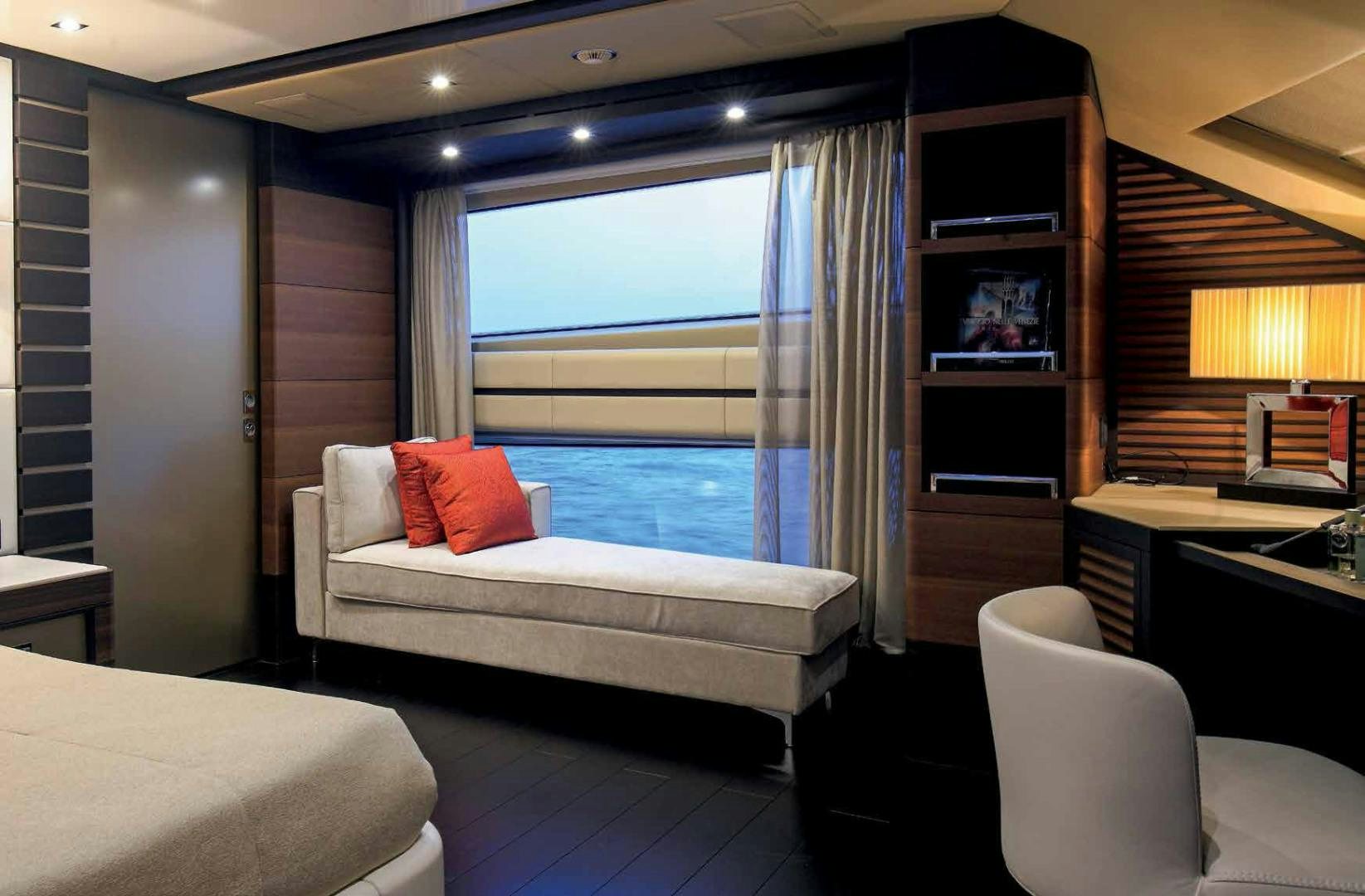 a room with a bed and a window aboard DREW Yacht for Sale