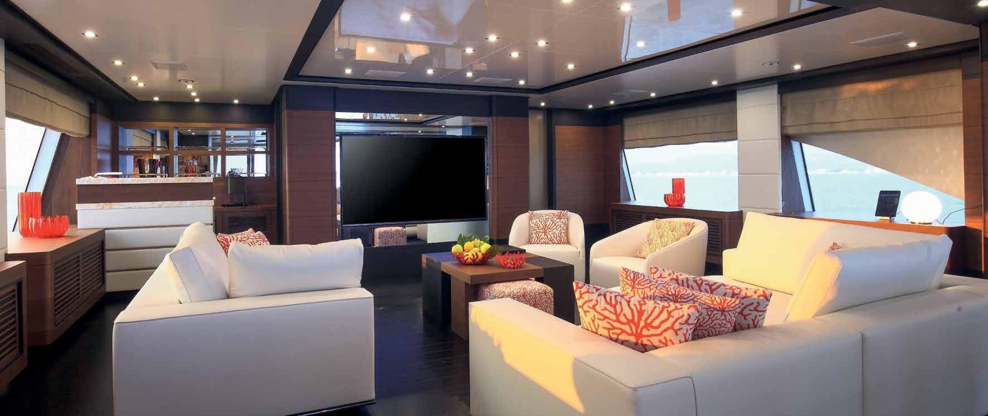 a room with couches and a tv aboard DREW Yacht for Sale