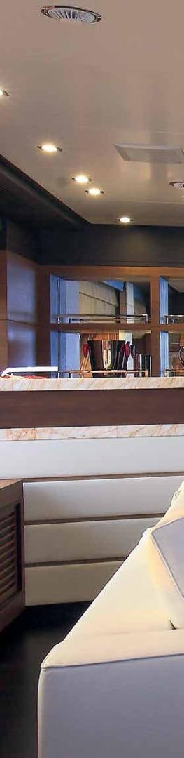 a room with a window and a table and chairs aboard DREW Yacht for Sale