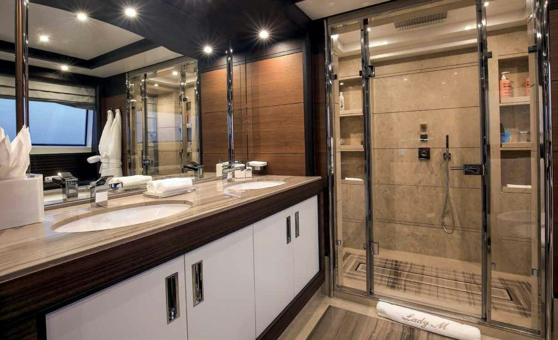 a bathroom with a large mirror aboard DREW Yacht for Sale