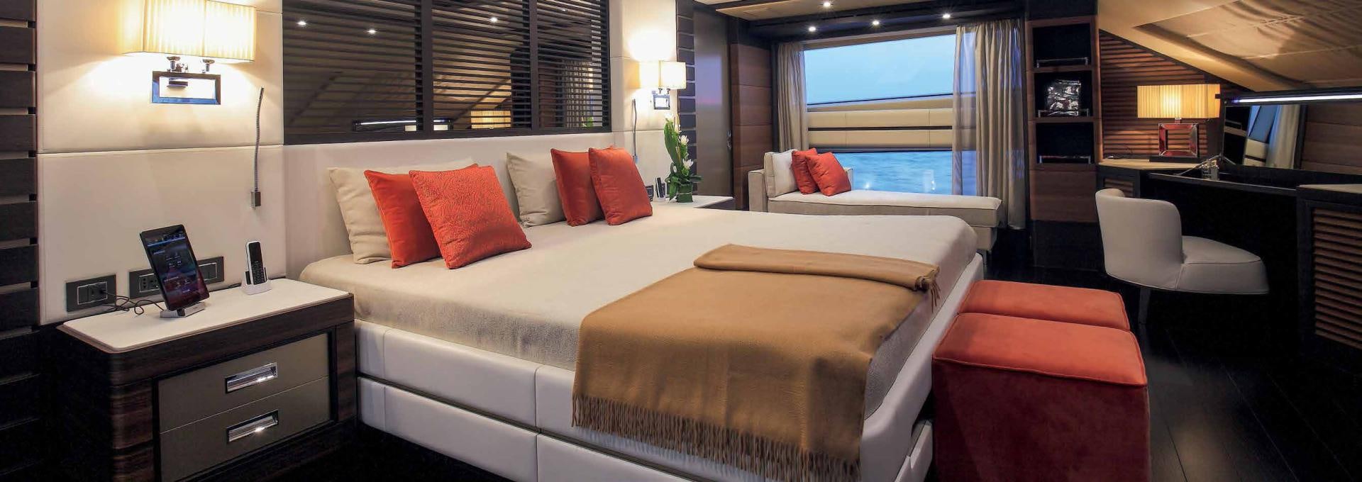 a hotel room with a bed and a window aboard DREW Yacht for Sale