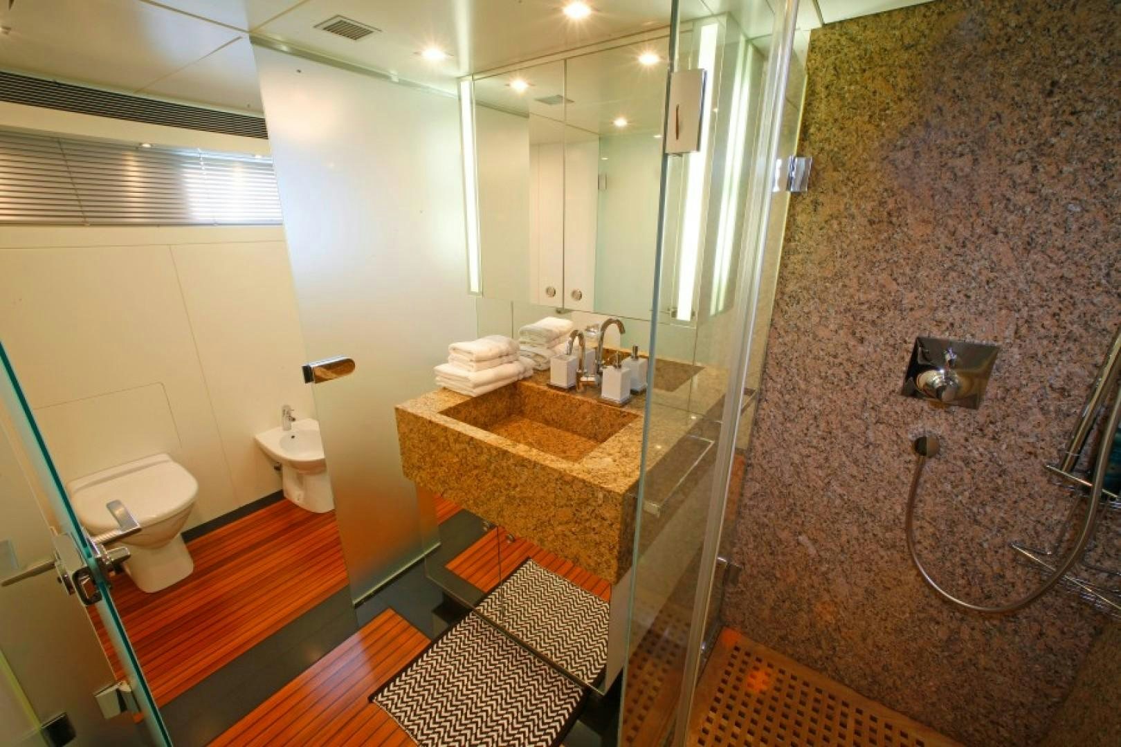 a bathroom with a glass shower aboard MR MOUSE Yacht for Sale