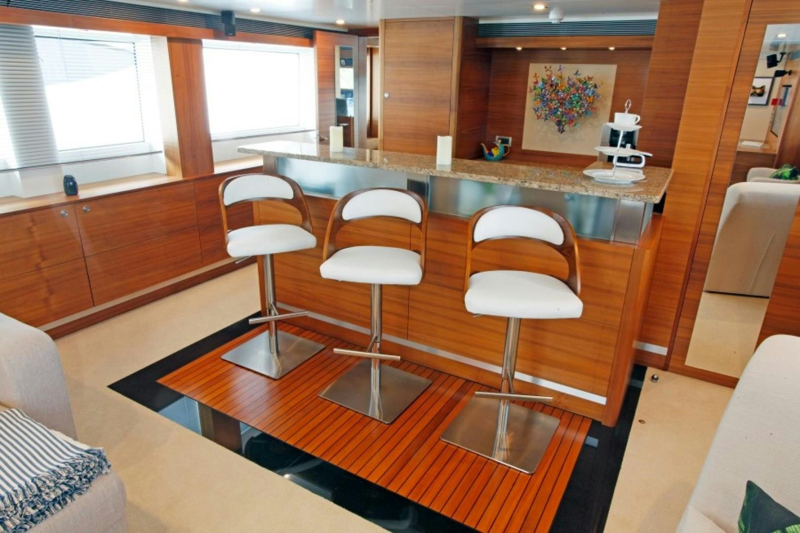 a room with a table and chairs aboard MR MOUSE Yacht for Sale