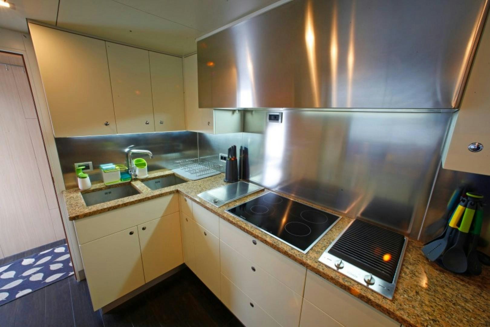 a kitchen with a sink and cabinets aboard MR MOUSE Yacht for Sale