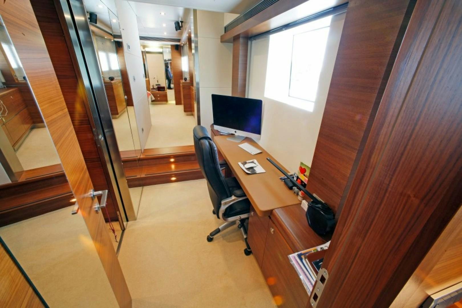 a room with a desk and a tv aboard MR MOUSE Yacht for Sale