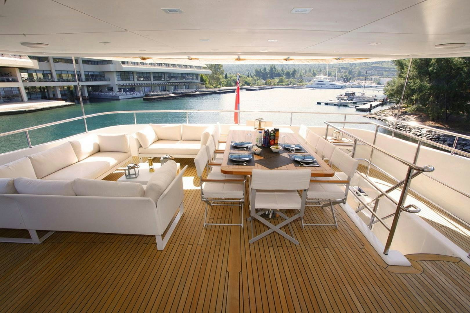 a room with a table and chairs aboard MR MOUSE Yacht for Sale