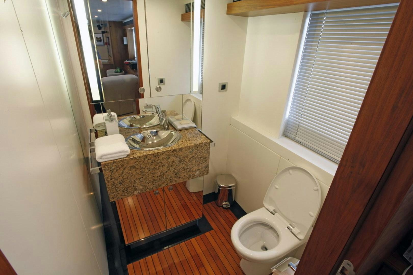 a bathroom with a sink toilet and a mirror aboard MR MOUSE Yacht for Sale