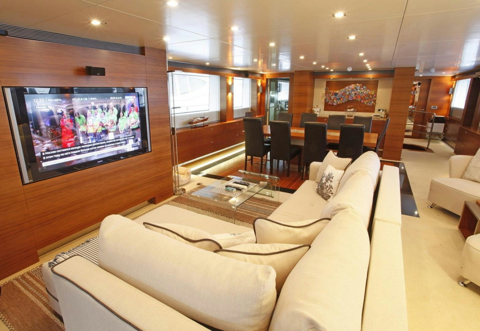a room with couches and a tv aboard MR MOUSE Yacht for Sale
