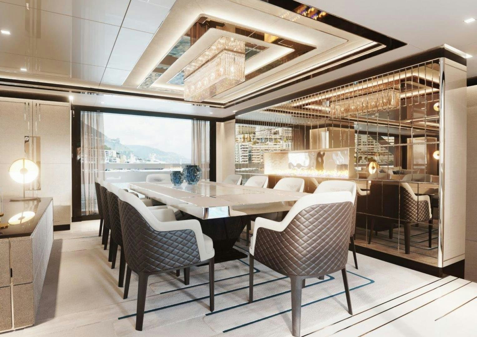 a room with a table chairs and a view of the ocean aboard GTT 135 Yacht for Sale