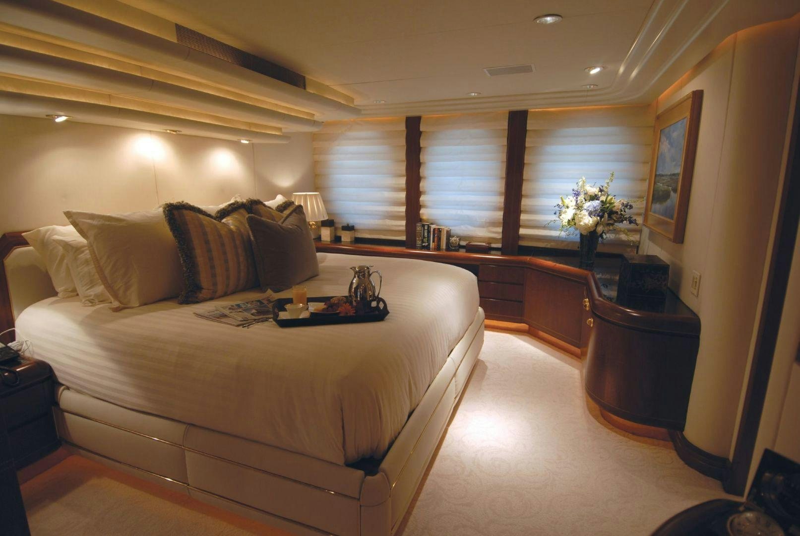 a bedroom with a large bed aboard NEVER ENOUGH Yacht for Charter